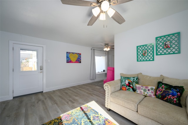 living room with ceiling fan and light hardwood / wood-style floors