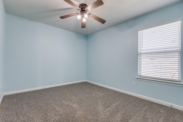 unfurnished room with ceiling fan and carpet floors