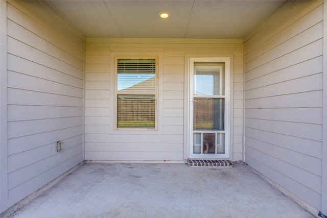 property entrance with a patio area