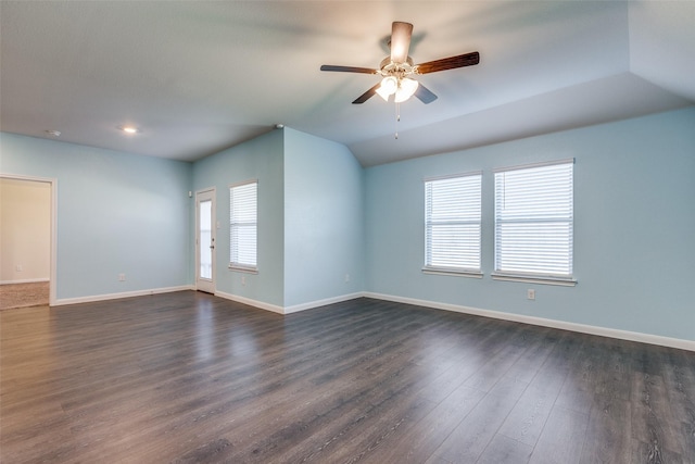 unfurnished room with vaulted ceiling, ceiling fan, and dark hardwood / wood-style floors