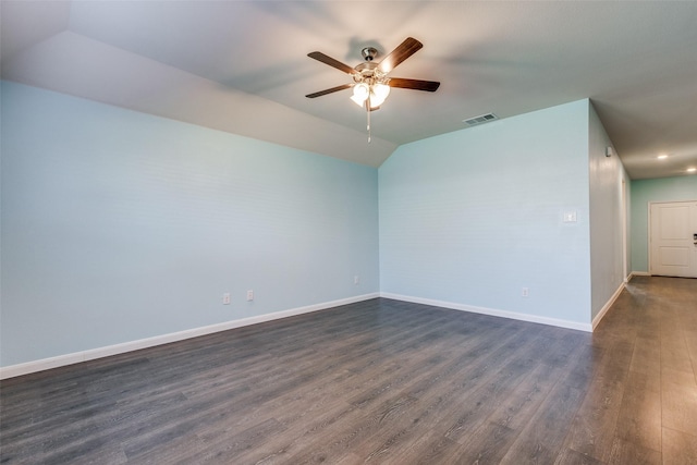 unfurnished room with ceiling fan, lofted ceiling, and dark wood-type flooring