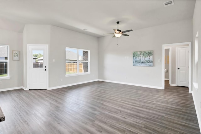 unfurnished living room featuring dark hardwood / wood-style floors and ceiling fan