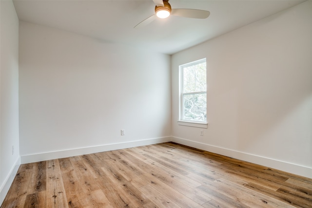 unfurnished room with ceiling fan and light wood-type flooring