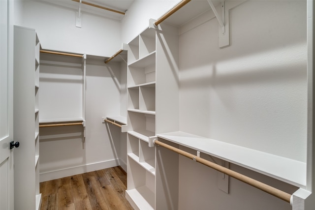 spacious closet with light hardwood / wood-style floors