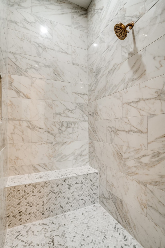 bathroom with tiled shower