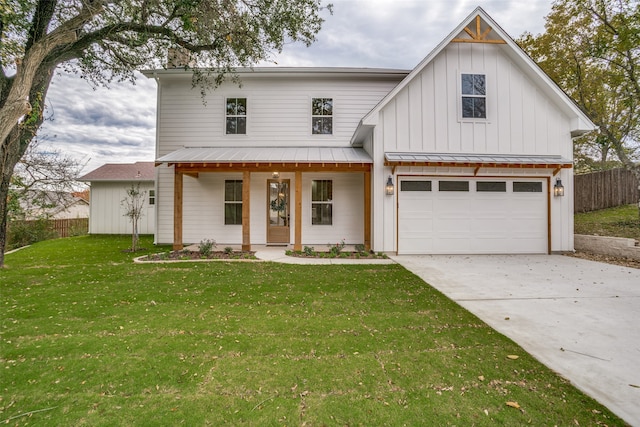 modern farmhouse style home with a garage, covered porch, and a front lawn