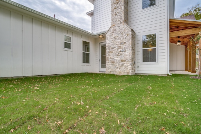 property entrance with a yard