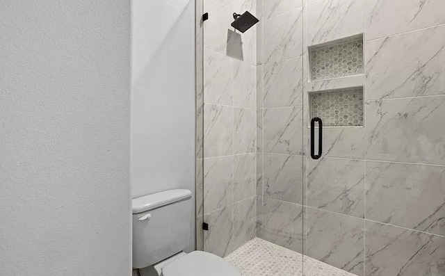 bathroom with toilet and walk in shower