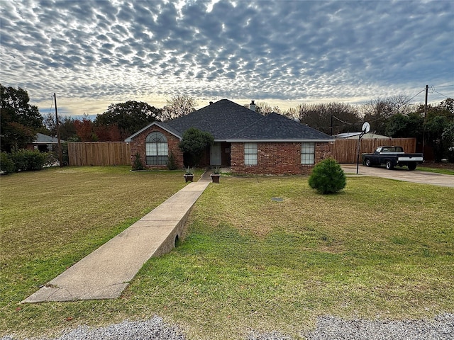 view of front of property with a yard