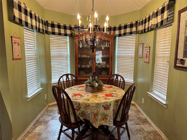 dining room featuring a wealth of natural light and a chandelier