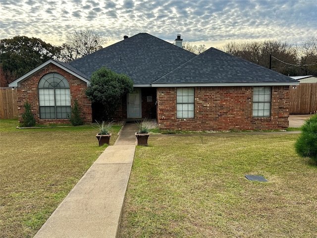 ranch-style home with a front yard