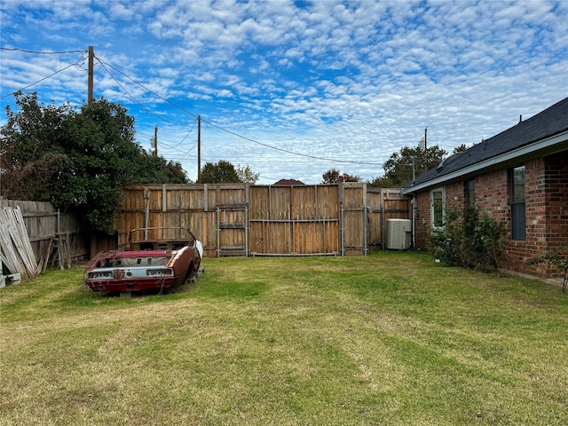 view of yard with central AC