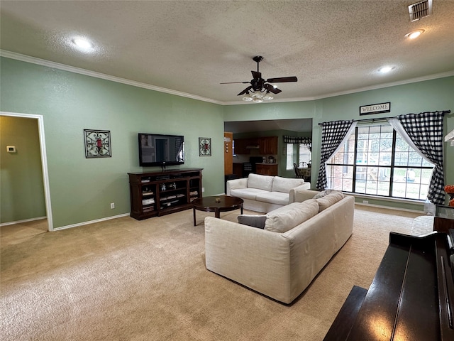 living room with crown molding, light colored carpet, and a textured ceiling