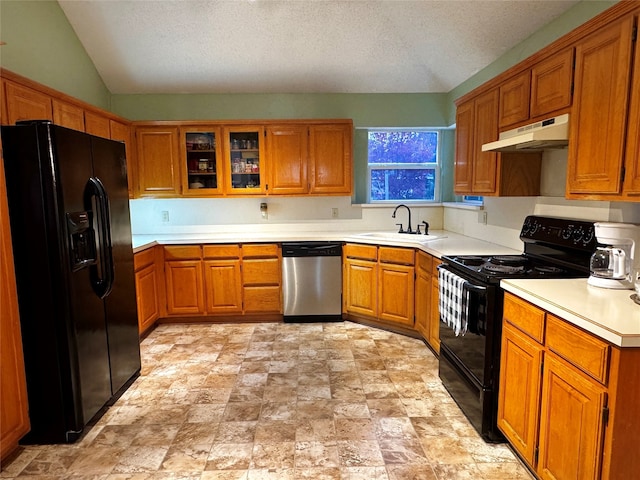 kitchen featuring a textured ceiling, sink, black appliances, and lofted ceiling