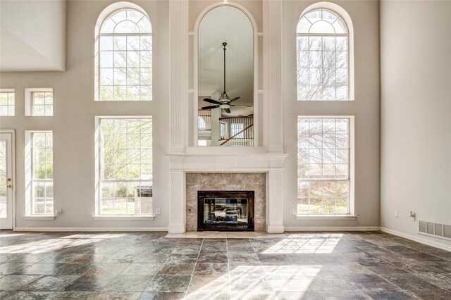 kitchen featuring decorative backsplash, a kitchen island, black appliances, and decorative light fixtures