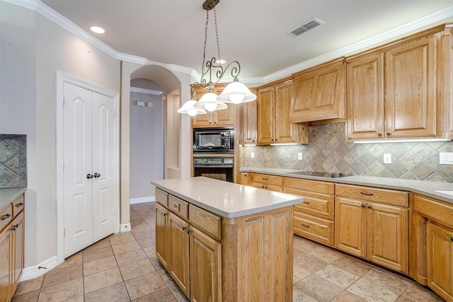 kitchen with black appliances, decorative light fixtures, a center island, and backsplash