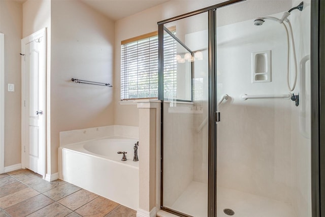 bathroom with tile patterned floors and independent shower and bath