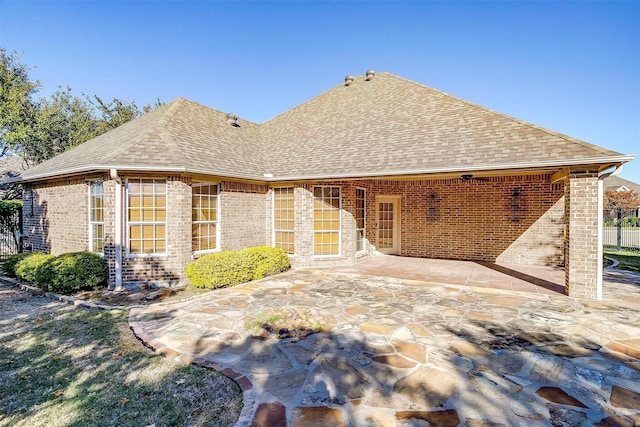 rear view of house with a patio