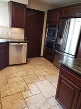 kitchen featuring tasteful backsplash, dark brown cabinetry, and stainless steel appliances