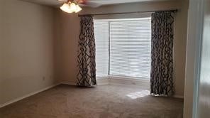 unfurnished room with carpet, ceiling fan, and a healthy amount of sunlight