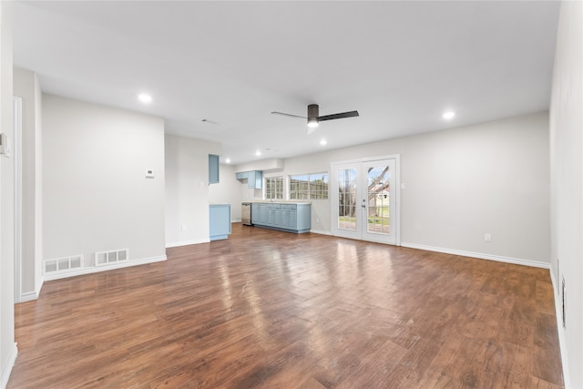 unfurnished living room with french doors, dark hardwood / wood-style flooring, and ceiling fan