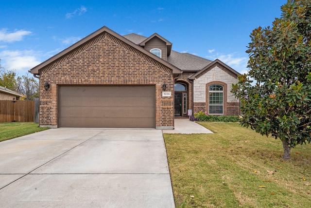 view of front property with a garage and a front yard