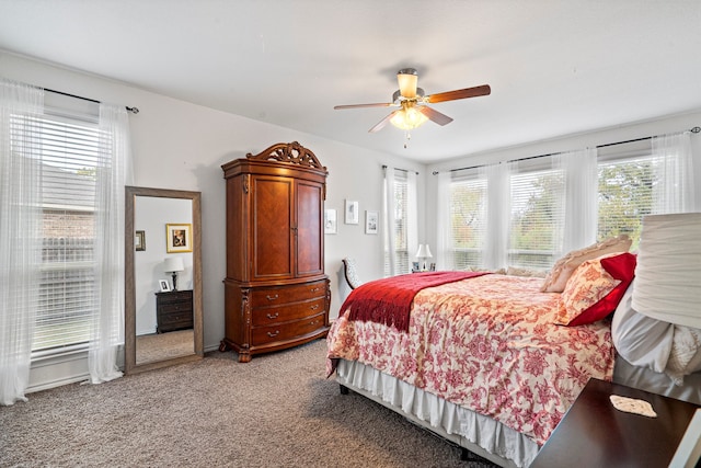 bedroom featuring ceiling fan and light carpet