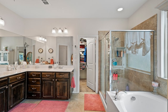 bathroom with separate shower and tub, tile patterned floors, and vanity