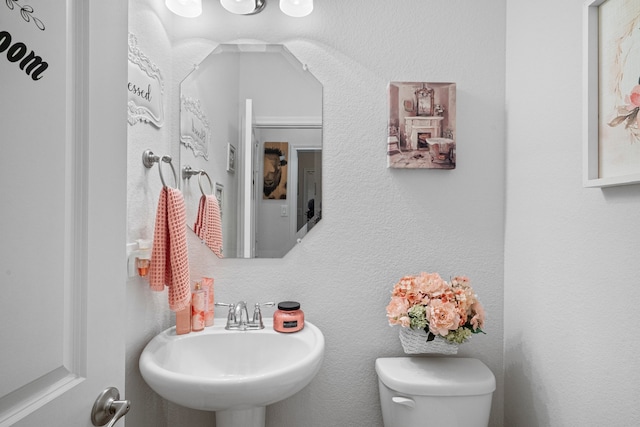 bathroom with sink and toilet