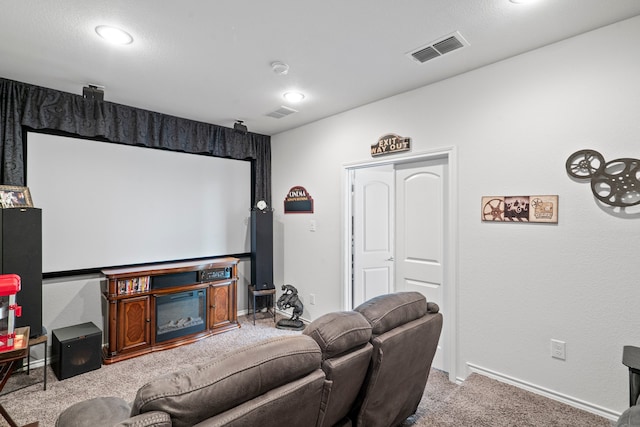 home theater room featuring light carpet