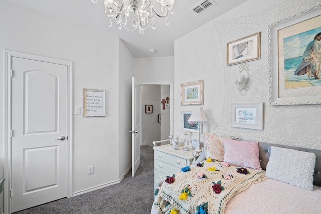 carpeted bedroom with an inviting chandelier