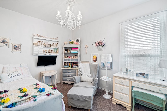 carpeted bedroom featuring an inviting chandelier