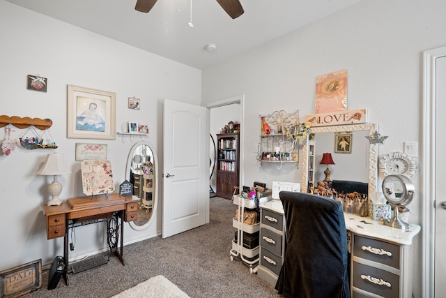 office with ceiling fan and dark carpet