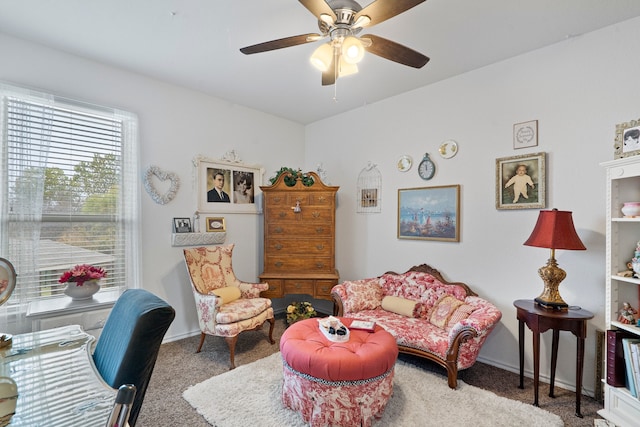 living room featuring carpet flooring and ceiling fan