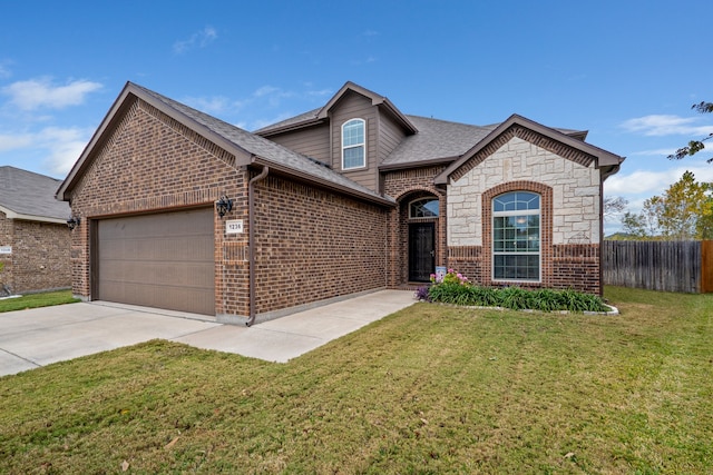 view of front of home with a garage and a front yard