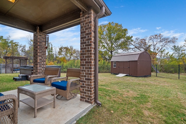 view of yard with a storage unit, a patio, and a hot tub