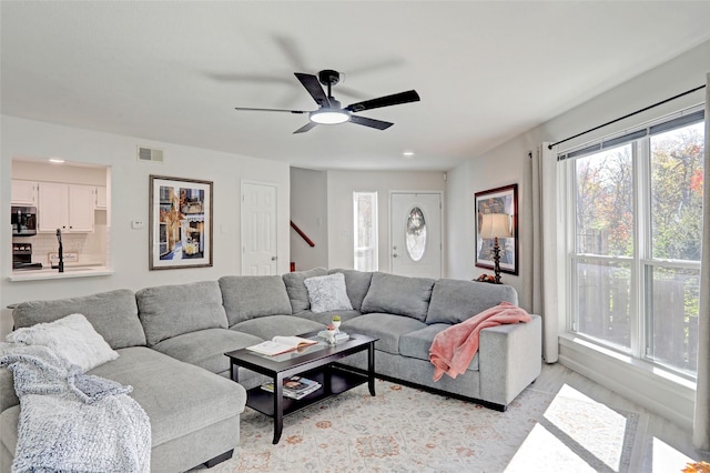 living room with ceiling fan