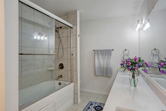 bathroom with enclosed tub / shower combo, vanity, and tile patterned floors