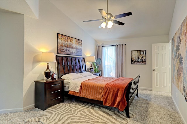 bedroom featuring ceiling fan, light colored carpet, and vaulted ceiling