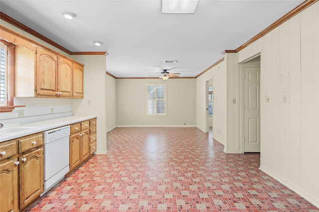 kitchen featuring wood walls, white dishwasher, sink, crown molding, and ceiling fan