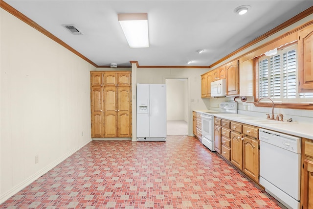 kitchen with sink, white appliances, and crown molding