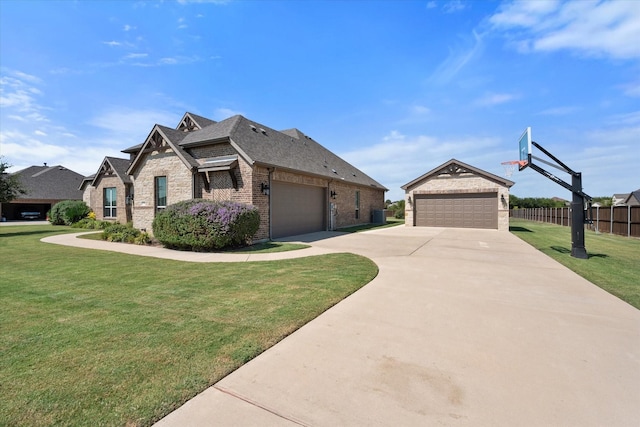 view of front of property featuring a garage and a front lawn