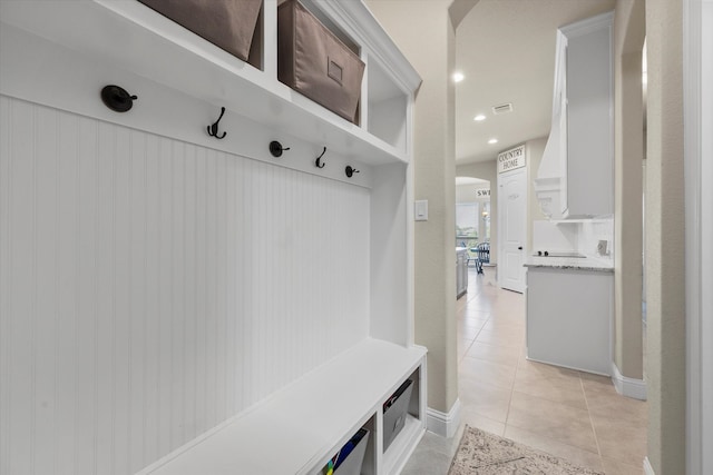 mudroom with light tile patterned floors