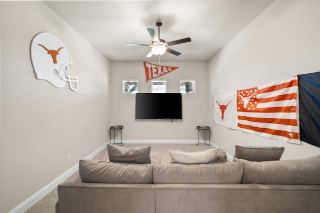 living room featuring carpet flooring and ceiling fan