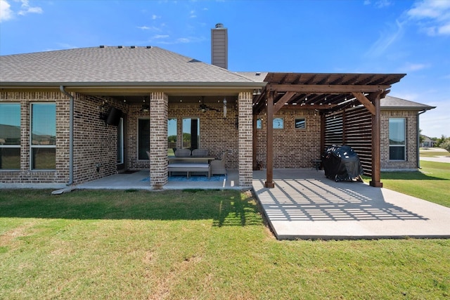 rear view of house with a yard, an outdoor hangout area, ceiling fan, and a patio area