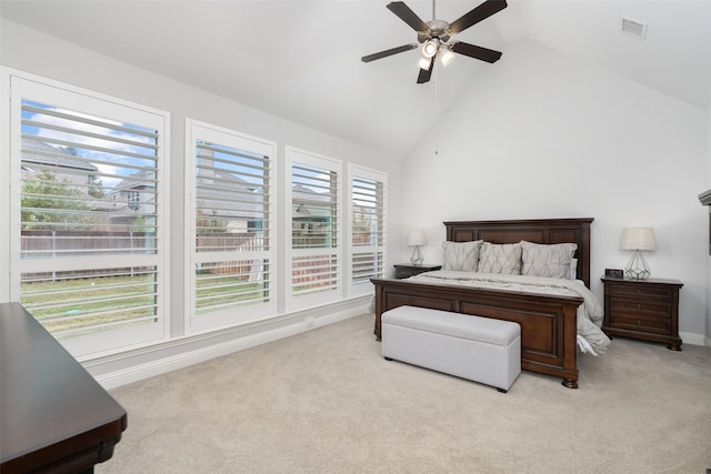 bedroom with high vaulted ceiling, light colored carpet, and ceiling fan