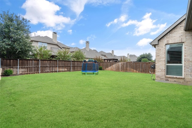 view of yard featuring a trampoline