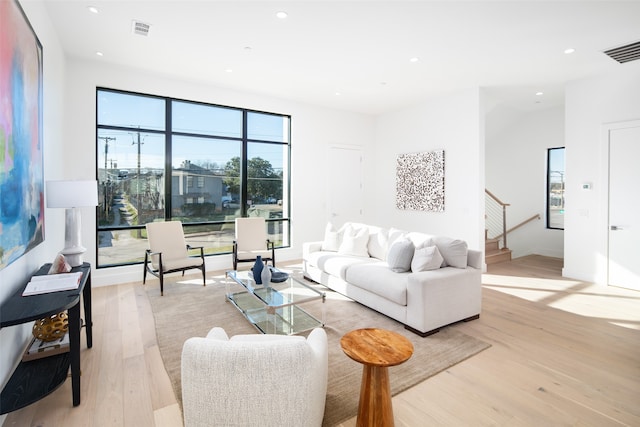 living room with light hardwood / wood-style flooring