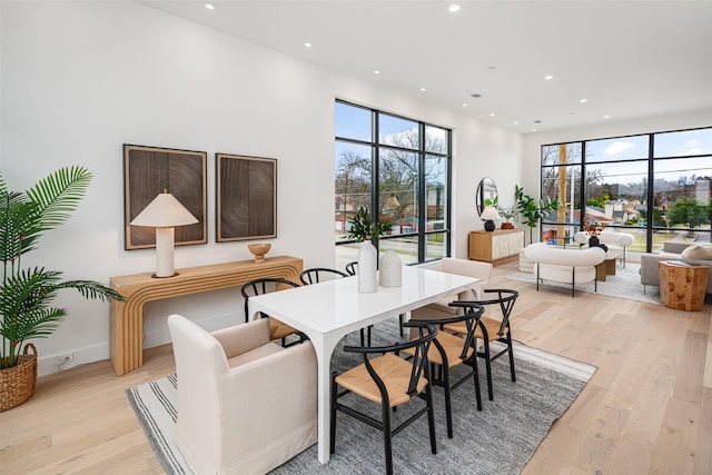 interior space featuring light wood finished floors, plenty of natural light, and recessed lighting