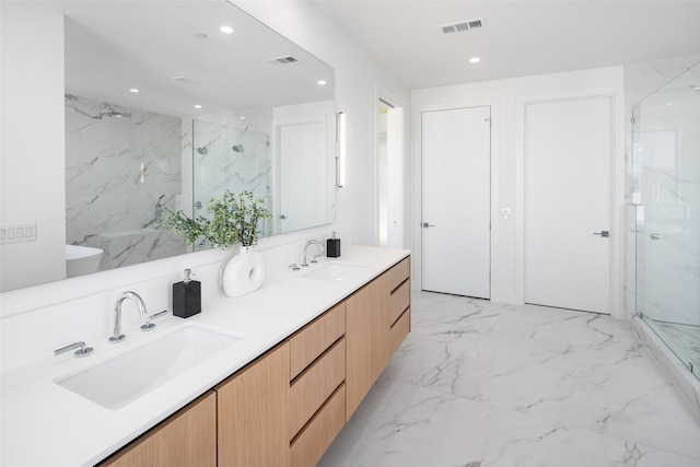 bathroom featuring walk in shower and vanity